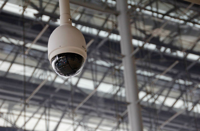 Photo of a CCTV camera hanging from roof