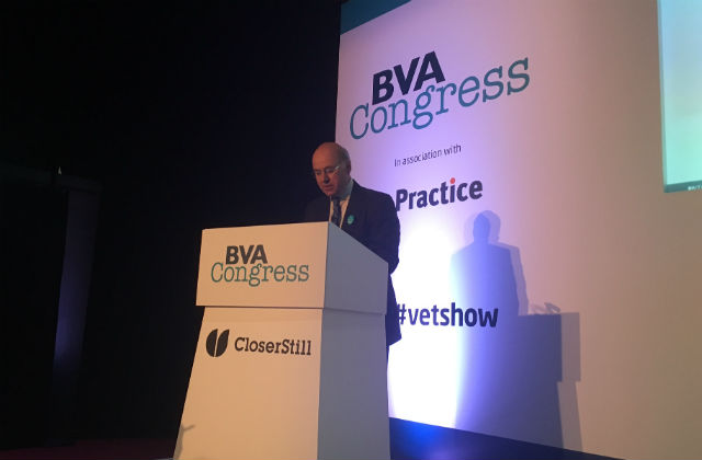 An image of Lord Gardiner at a lectern addressing the audience