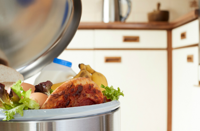 An image of over flowing food waste in a bin