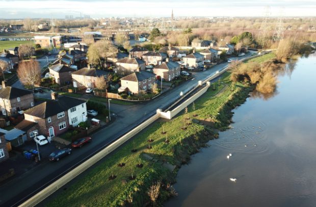 images shows a long wall which is part of Warrington's new £34 million flood defence scheme