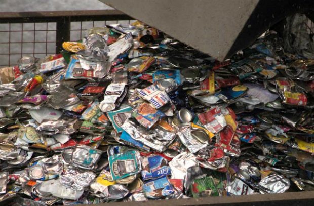 An image of crushed aluminium food and drinks cans.