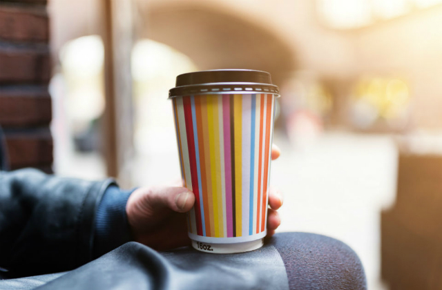 Image of someone holding a reusable cup