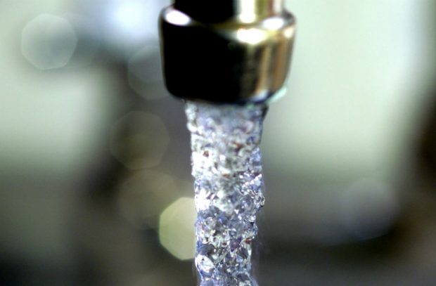 An image of water running from a tap.