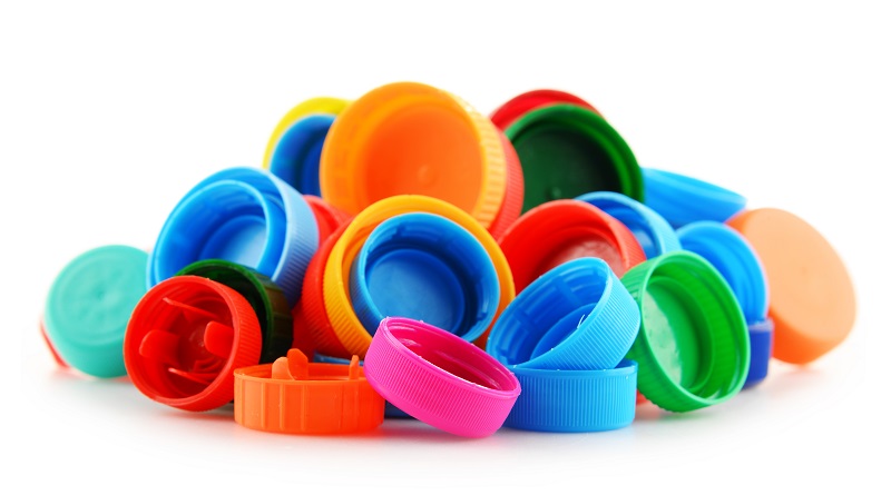 A picture of plastic bottle caps in different colours