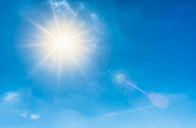 Image of blue sky and sun.