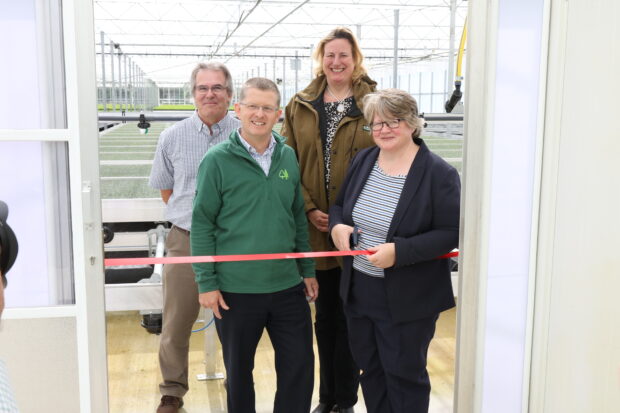 An image of Minister Coffey, Antoinette Sandbach MP for Eddisbury, Mike Seddon, Director of Operations, Forest Enterprise, Alan Harrison, Head of Plant and Seed Supply (Forestry Commission). Minister Coffey is cutting the opening ribbon.