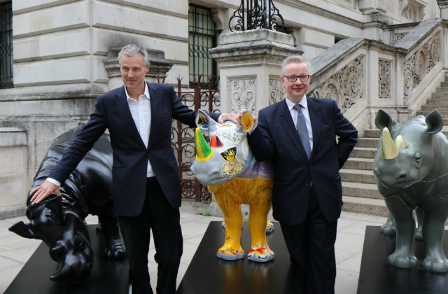 An image of Zac Goldsmith MP and the Environment Secretary, Michael Gove, with the Tusk Trust rhino artworks.