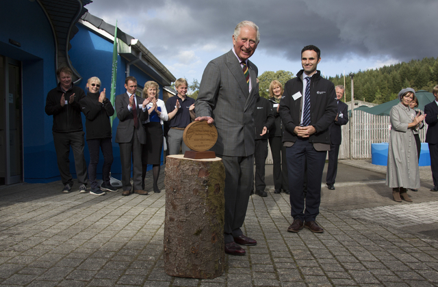 An image of Prince Charles unveiling a commerative plaque for the new visitor centre.