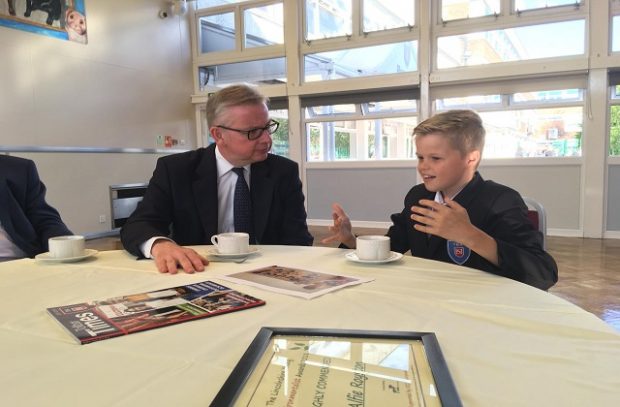 Environment Secretary Michael Gove presenting Alfie Royston from Tollbar Academy with a #refill reusable bottle