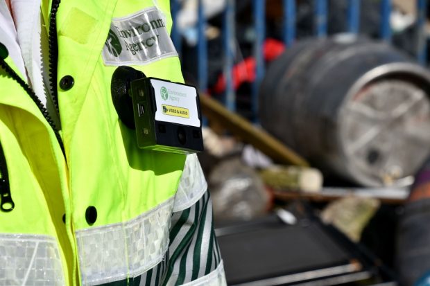 Image of a person with a high vis vest on and a body cam.