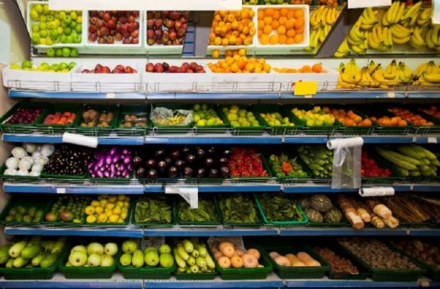 An image of fruits and vegetables at a supermarket.