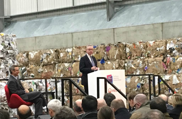 An image of the Environment Secretary speaking on a stage at the Waste to Wealth Summit.