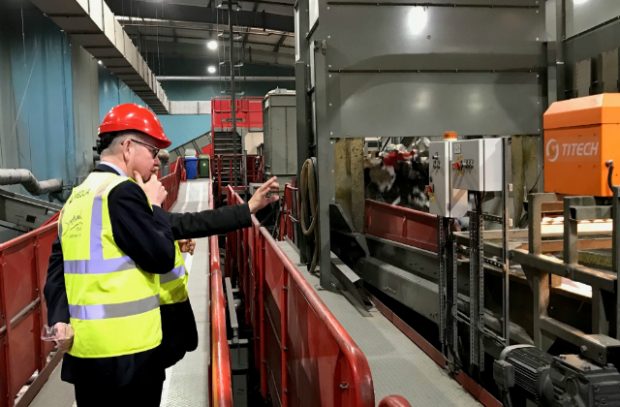 An image of Environment Secretary Michael Gove looking at recycling procedures at Veolia launching the Resources and Waste Strategy.