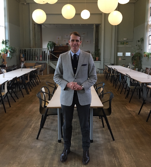 An image of Ben Elliot standing in the restaurant area at Refettorio Felix.