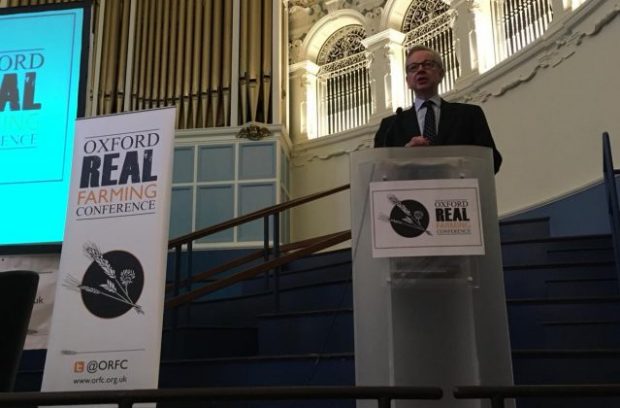 An image of the Environment Secretary speaking at a podium at the Oxford Real Farming Conference.