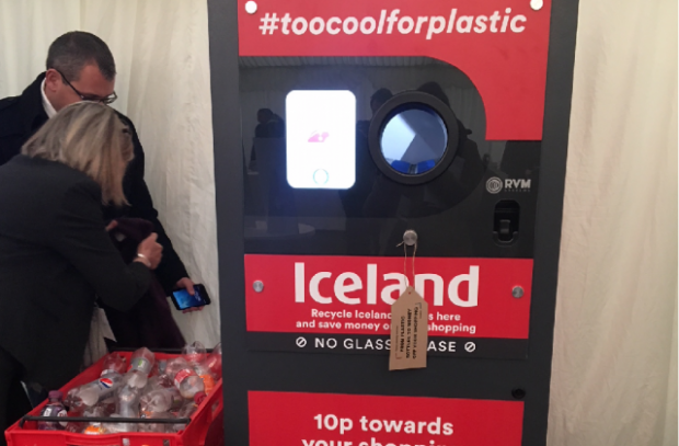 An image of Iceland's new recycling machine, with a tagline that says #toocoolforplastic