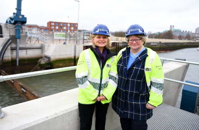 Image of the Flood Minister standing by a river in Ipswich.