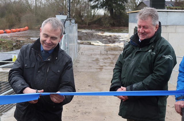 An image of Minister Goodwill cutting the ribbon for the new fish passage scheme.