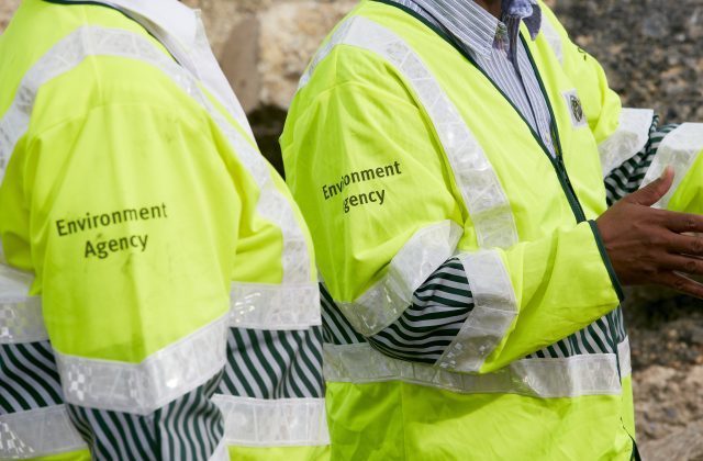 An image of Environment Agency officers in yellow high visability jackets