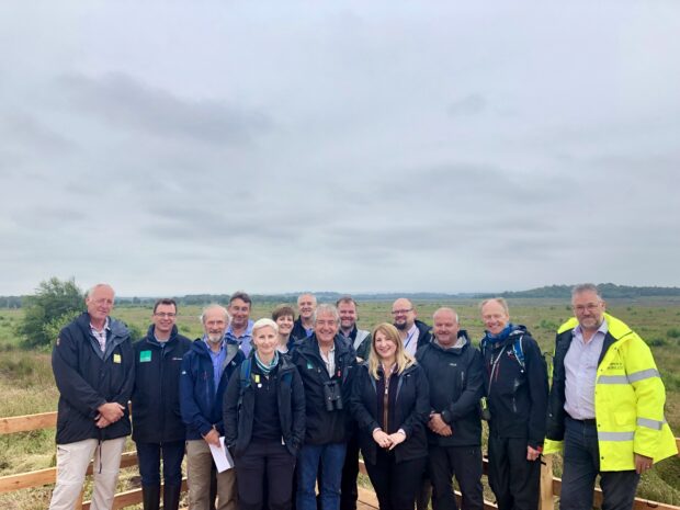 Picture showing Natural England staff with the new Bolton Fell and Walton Mosses declaration 