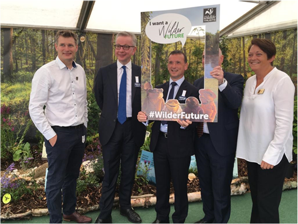 The Environment Secretary, Michael Gove, and Welsh Secretary, Alun Cairns, with local Wildlife Trust representatives at the Royal Welsh Show