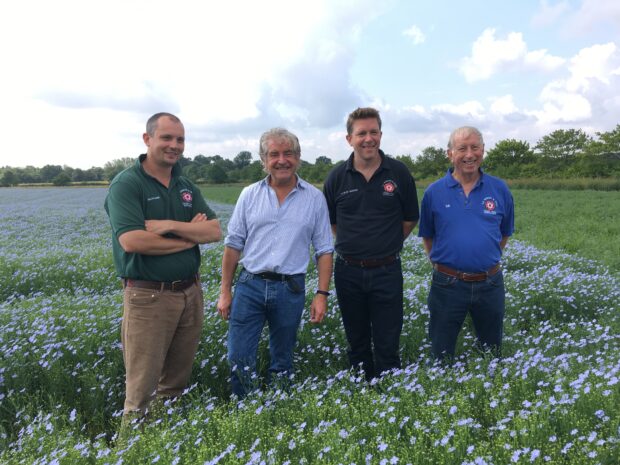 An image of Brian Barker, Tony Juniper, Patrick Barker and David Barker in a field.