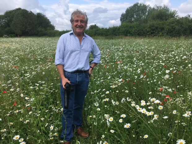 An Image of Tony Juniper in pollen and nectar plot field 