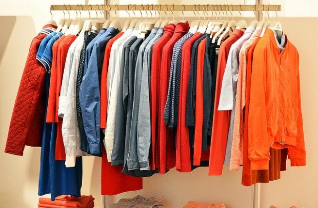 A range of jackets lined up on a clothes rail