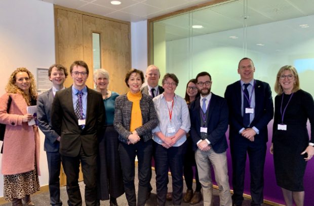 Minister Pow (centre) surrounded by representatives of environmental and farming groups, inside the room where their meeting took place.