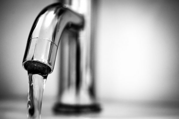 An image of a stainless steel faucet