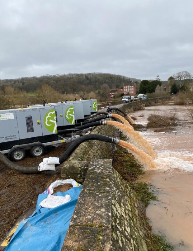 Environment Agency officials pumping flood water away