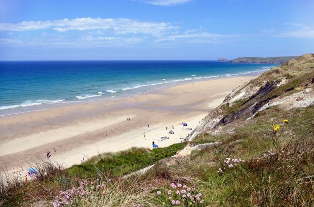 A beach in Cornwall with swimmers