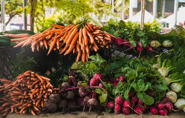 An image of root vegetables on a stall