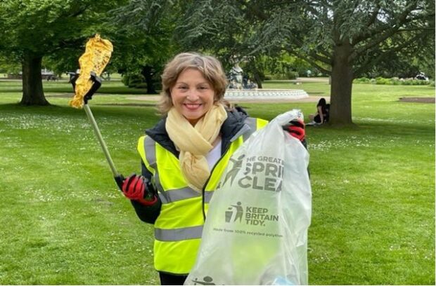 Minister Pow picking litter