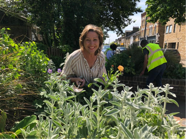 Image of Environment Minister Rebecca Pow behind green plants.