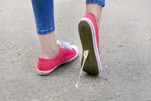 Chewing gum stuck to the bottom of a shoe