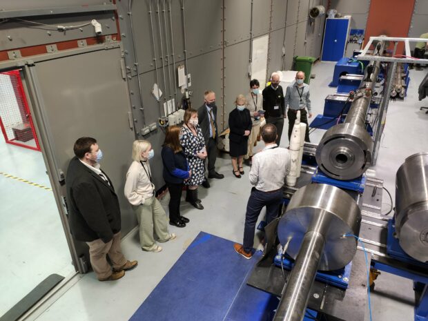 Our team with NRW staff at First Light Fusion learning about the gas gun