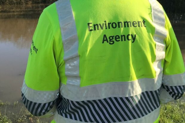 Environment Agency officer in a high-vis jacket.