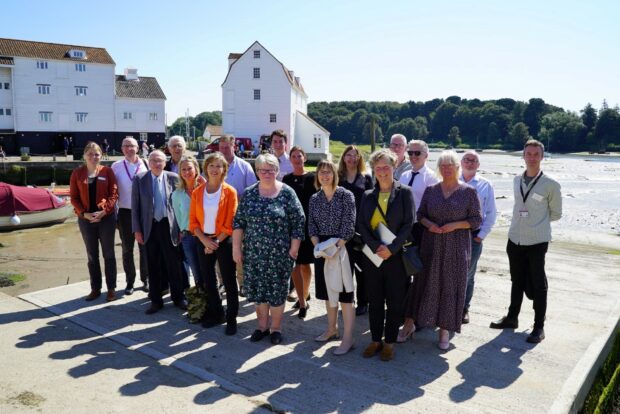 Roundtable attendees stood next to the River Deben 
